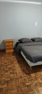 Łóżko lub łóżka w pokoju w obiekcie La maison Do