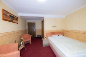 Postel nebo postele na pokoji v ubytování Hotel Am Rathaus