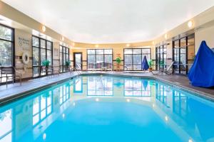a large swimming pool with blue water in a building at Hampton Inn Ringgold-Ft. Oglethorpe in Ringgold