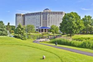 a view of a building from a golf course at Hilton Chicago Oak Brook Hills Resort & Conference Center in Oak Brook