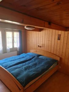 Postel nebo postele na pokoji v ubytování Ferienwohnung Berner Oberland - Guttannen