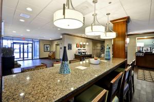a kitchen and living room with a large counter top at Hampton Inn Chicago-Gurnee in Gurnee