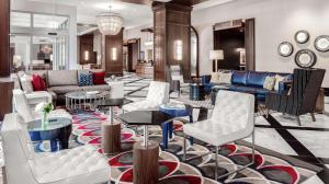 a lobby with couches and chairs and tables at Hilton Garden Inn Chicago McCormick Place in Chicago