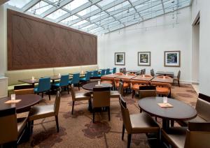 a large room with tables and chairs and a large chalkboard at Hilton Garden Inn Chicago Downtown Riverwalk in Chicago