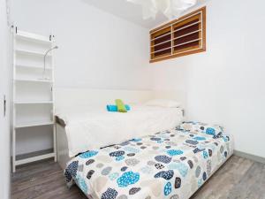 a small bedroom with a bed in a room at Live Tabaiba Maritime Avenue con vista del mar in Tabaiba