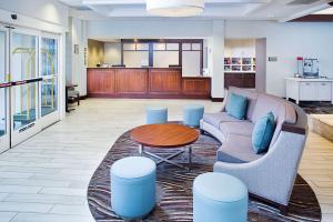 a living room with a couch and a table at Homewood Suites by Hilton Cleveland-Solon in Solon