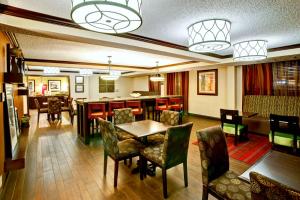 a dining room with a table and chairs at Hampton Inn College Station-Near Texas A&M University in College Station