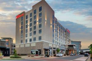 a rendering of a hotel building in a city at Hilton Garden Inn Charlotte Waverly in Charlotte