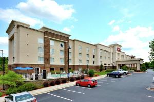 a parking lot in front of a hotel at Hampton Inn & Suites Huntersville in Huntersville