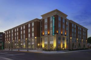 a large brick building on a city street at night at Homewood Suites by Hilton Columbus OSU, OH in Columbus