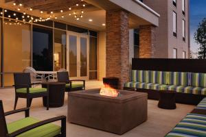 a patio with a couch and a fire pit at Home2 Suites By Hilton Columbus Dublin in Dublin