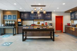 a lobby of a fast food restaurant with a counter at Hampton Inn & Suites Cody, Wy in Cody