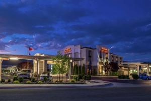 a hotel with cars parked in a parking lot at Hampton Inn & Suites Carson City in Carson City