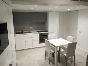 A kitchen or kitchenette at Duomo Inn