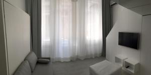 A television and/or entertainment centre at Duomo Inn