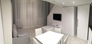 A bed or beds in a room at Duomo Inn