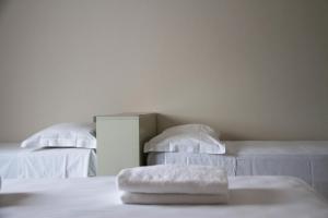 Postel nebo postele na pokoji v ubytování Hotel Arianna
