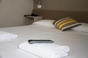 Postel nebo postele na pokoji v ubytování Hotel Arianna