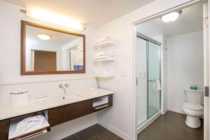 a bathroom with a sink and a toilet and a mirror at Hampton Inn & Suites - Cincinnati/Kenwood, OH in Cincinnati