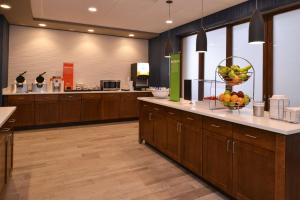 a kitchen with a counter with a bowl of fruit on it at Hampton Inn & Suites Cincinnati-Mason, Ohio in Mason