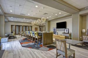 a conference room with a long table and chairs at Hampton Inn Blue Ash/Cincinnati, OH in Blue Ash