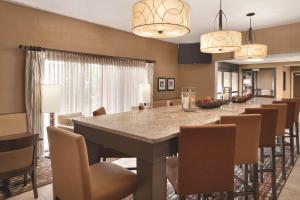 a large dining room with a long table and chairs at Hampton Inn Cincinnati Kings Island in Mason