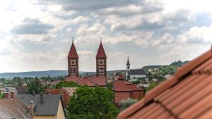 a view of a city with two clock towers at Arácsi Apartman 1610 in Balatonfüred