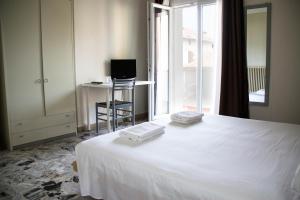 Postel nebo postele na pokoji v ubytování Hotel Arianna