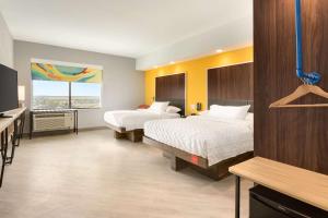 Postel nebo postele na pokoji v ubytování Tru By Hilton Cheyenne + 29 fotografií