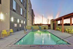 a swimming pool in the middle of a building at Home2 Suites By Hilton McKinney in McKinney