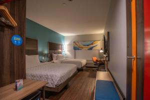 Postel nebo postele na pokoji v ubytování Tru By Hilton Allen Dallas, Tx