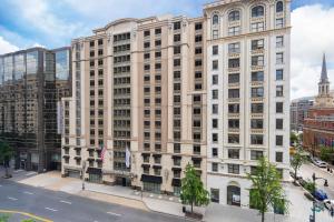 a large white building on a city street at Hilton Garden Inn Washington DC Downtown in Washington