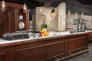 a kitchen with a counter with food on it at West End Washington DC, Tapestry Collection by Hilton in Washington, D.C.