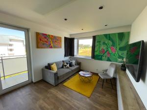A television and/or entertainment centre at MK Apartment FREE Parking