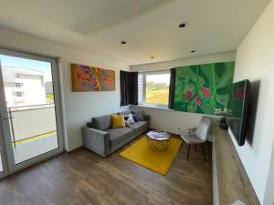 A television and/or entertainment centre at MK Apartment FREE Parking