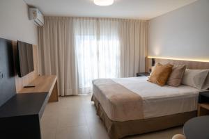 Cama ou camas em um quarto em Urbana Suites