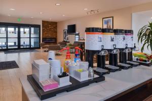 a kitchen counter with a coffee maker on display at Hampton Inn & Suites Denver-Speer Boulevard in Denver