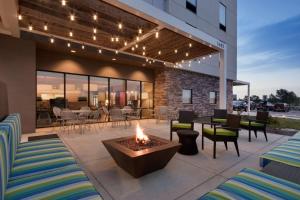 a fire pit in the middle of a patio at Home2 Suites by Hilton Denver Highlands Ranch in Highlands Ranch