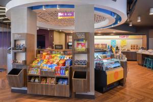 a store filled with lots of different types of food at Tru By Hilton Coppell DFW Airport North in Coppell