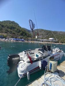a boat is docked at a dock in the water at Big Fishing Marmaris - Turkey Fishing Charter in Marmaris