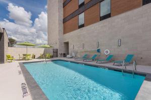 a swimming pool in front of a building at Home2 Suites By Hilton Dallas Grand Prairie in Grand Prairie