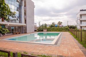 a swimming pool in the middle of a building at Stylish Studio on Ngong Road in Nairobi