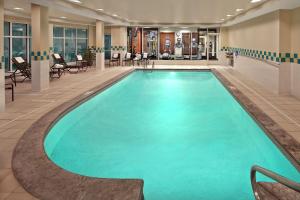a large swimming pool in a hotel lobby at Hilton Garden Inn Danbury in Danbury