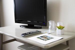 TV a/nebo společenská místnost v ubytování Hotel Arianna