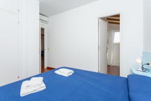Łóżko lub łóżka w pokoju w obiekcie Voramar Waterfront