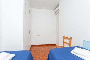 Łóżko lub łóżka w pokoju w obiekcie Voramar Waterfront