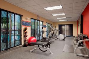 a fitness room with a gym with exercise equipment at Hampton Inn & Suites Detroit/Airport Romulus in Romulus