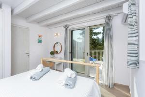 Postel nebo postele na pokoji v ubytování Villa Ifigeneia