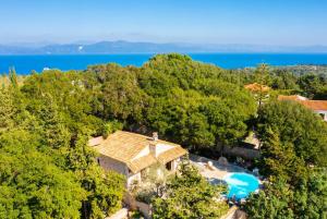 an aerial view of a house with a swimming pool at Villa Nionios in Vlachopoulátika