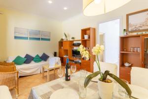 a living room with a couch and a table at Villa Torreta in Punta Prima